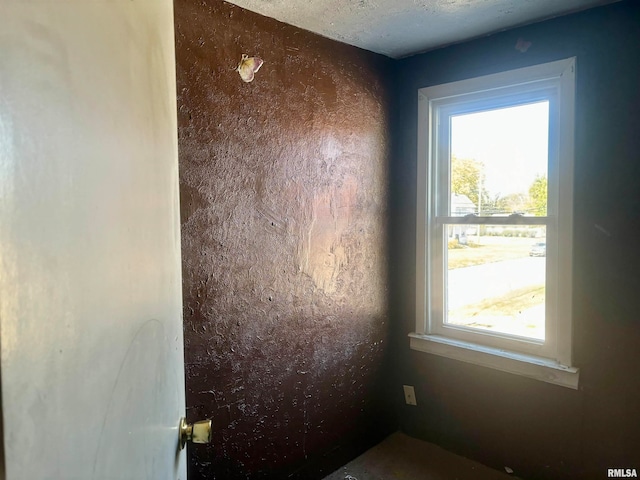 details with a textured ceiling