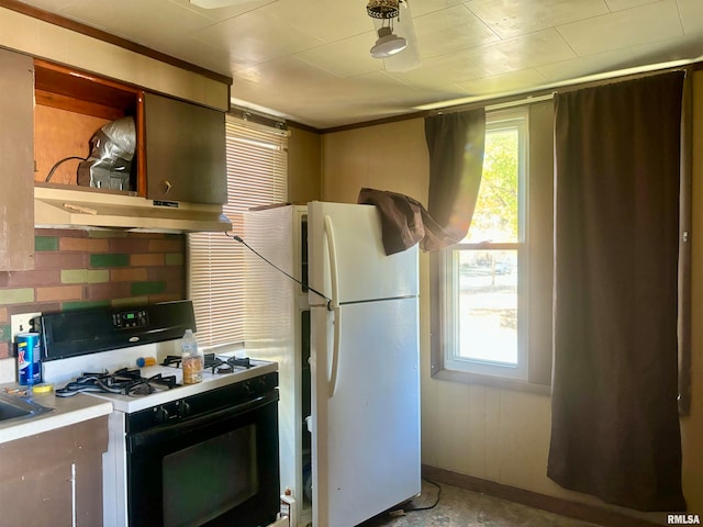 kitchen with white appliances and ventilation hood