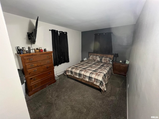 bedroom featuring dark colored carpet