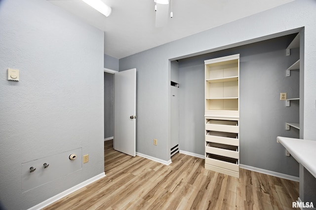 unfurnished bedroom with a closet and light hardwood / wood-style floors