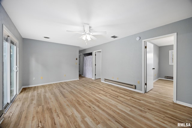 unfurnished room featuring baseboard heating, light hardwood / wood-style flooring, and ceiling fan