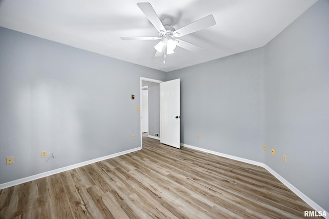 unfurnished room featuring ceiling fan and light wood-type flooring