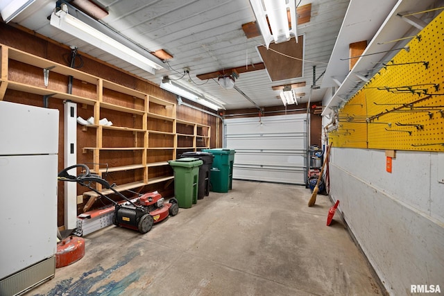 garage featuring white fridge