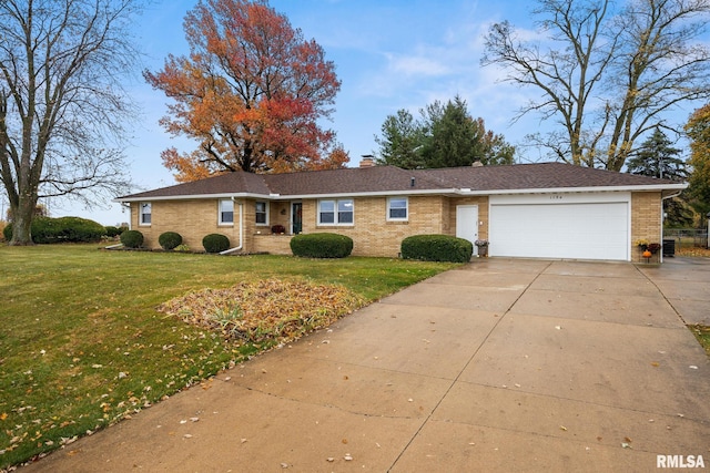 ranch-style house featuring a garage and a front yard