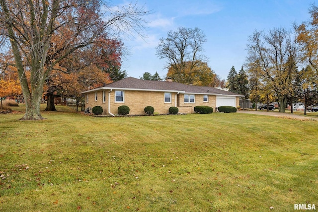 view of front of house with a garage and a front yard