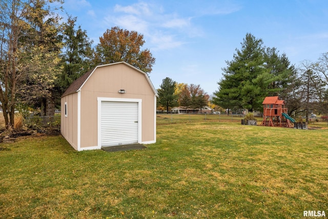 view of yard featuring a playground and a shed