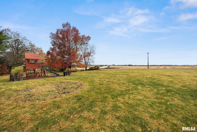 view of yard featuring a playground and a rural view