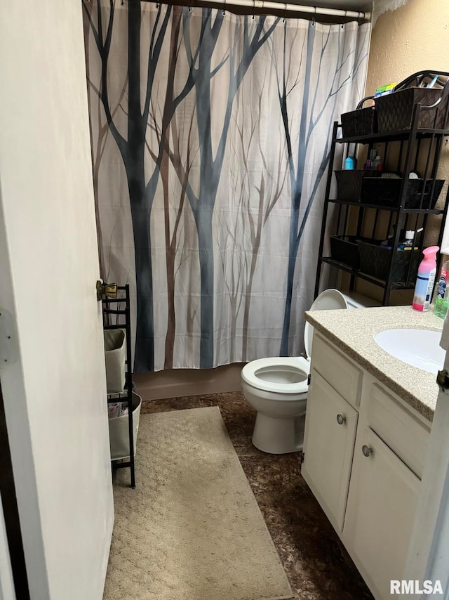 bathroom with vanity, a shower with shower curtain, and toilet