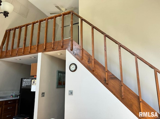 staircase with ceiling fan