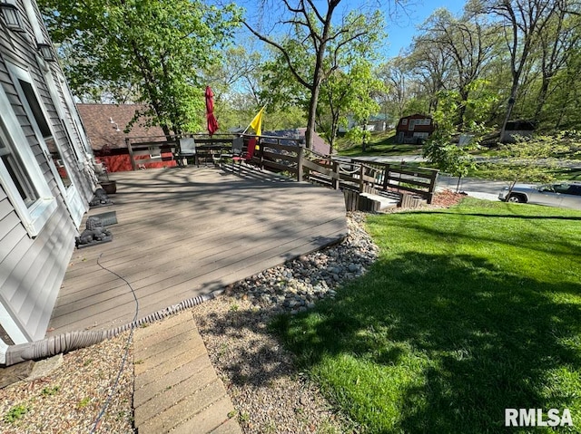 surrounding community featuring a lawn and a deck