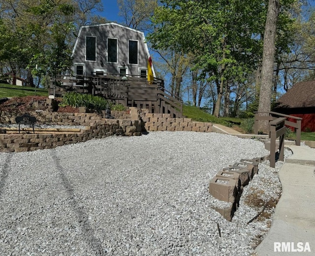 view of yard featuring stairway and a wooden deck