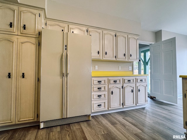 kitchen featuring dark hardwood / wood-style floors and white refrigerator