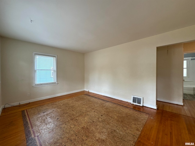 spare room featuring dark wood-type flooring