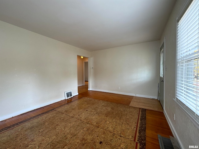 empty room featuring hardwood / wood-style flooring