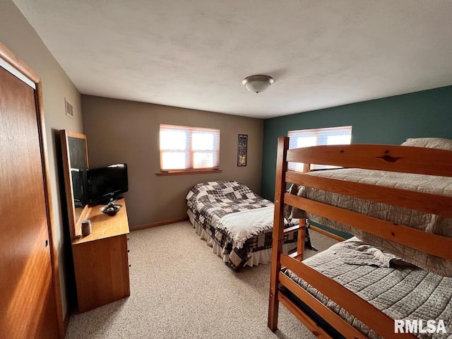 bedroom with light colored carpet