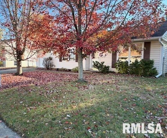 view of home's exterior featuring a yard