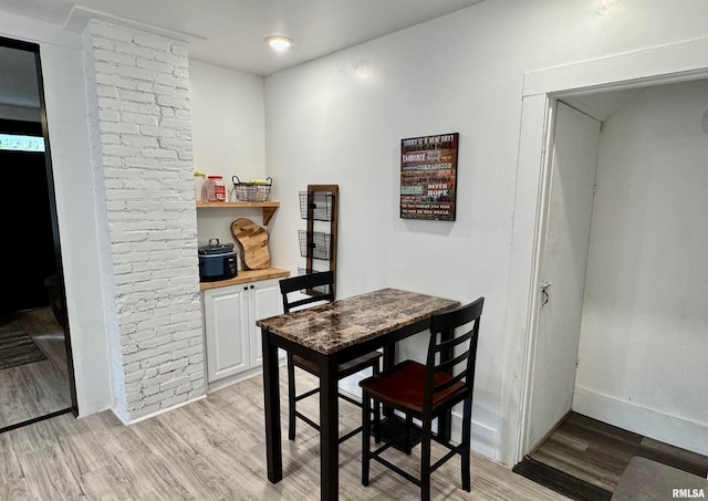 dining space featuring light hardwood / wood-style floors