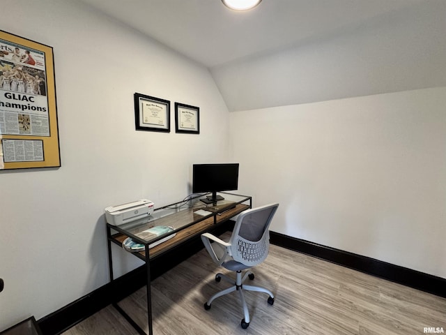 631 S Mcarthur St, Macomb, IL 61455 - home office featuring vaulted ceiling, wood finished floors, and baseboards