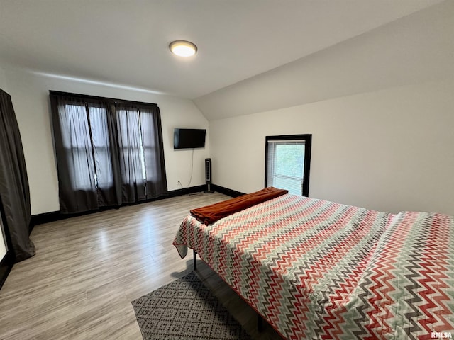 631 S Mcarthur St, Macomb, IL 61455 - bedroom with light wood-type flooring, baseboards, and lofted ceiling