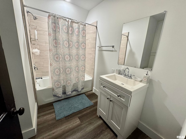 bathroom featuring shower / bath combination with curtain, hardwood / wood-style flooring, and vanity