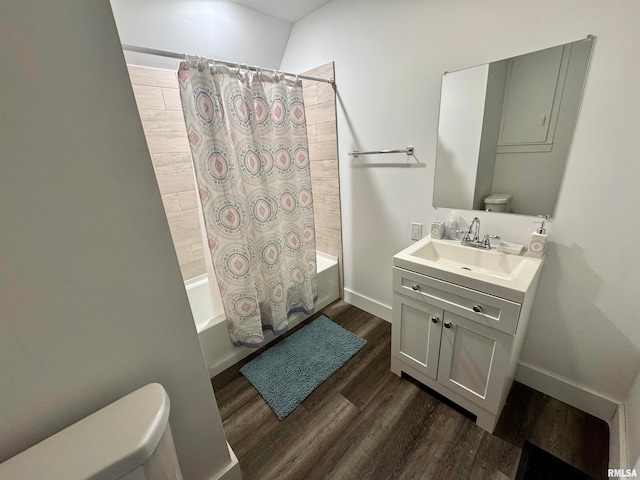 full bathroom featuring toilet, vanity, shower / bath combination with curtain, and wood-type flooring