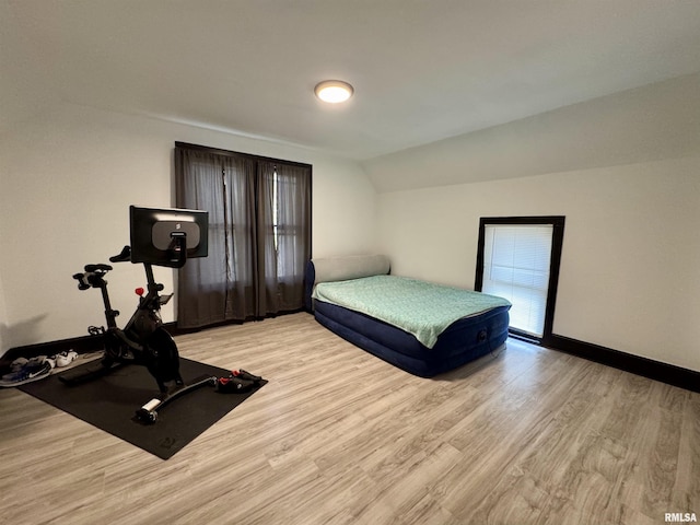 631 S Mcarthur St, Macomb, IL 61455 - bedroom with light wood finished floors, lofted ceiling, and baseboards
