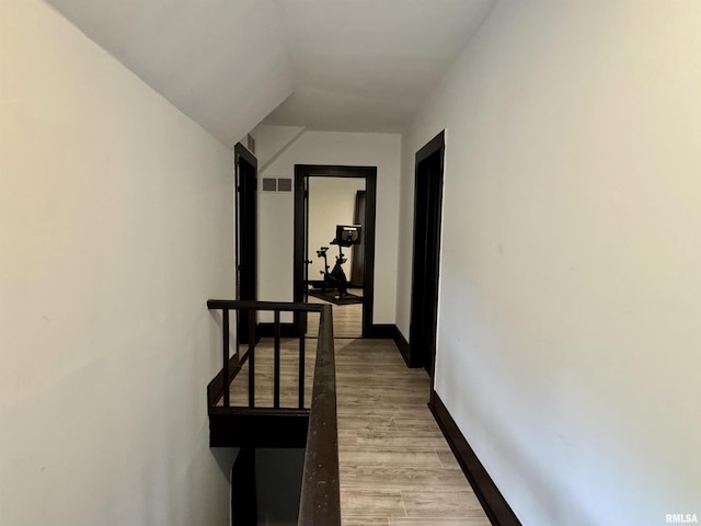 631 S Mcarthur St, Macomb, IL 61455 - corridor featuring baseboards, light wood-style flooring, and lofted ceiling