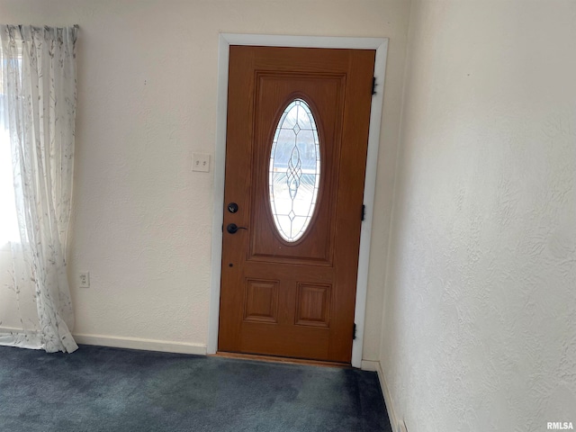 entryway featuring carpet floors