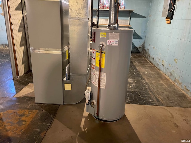 utility room featuring gas water heater and heating unit