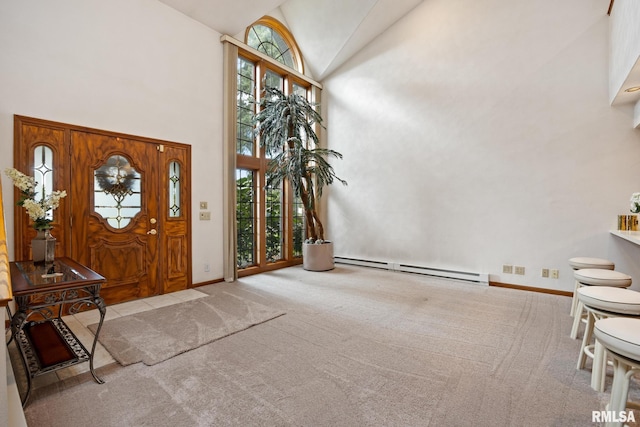 carpeted foyer entrance featuring high vaulted ceiling and baseboard heating