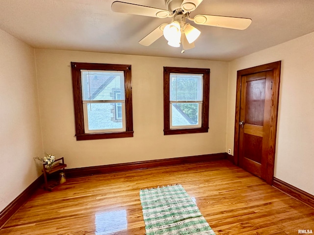 spare room with ceiling fan and light hardwood / wood-style flooring