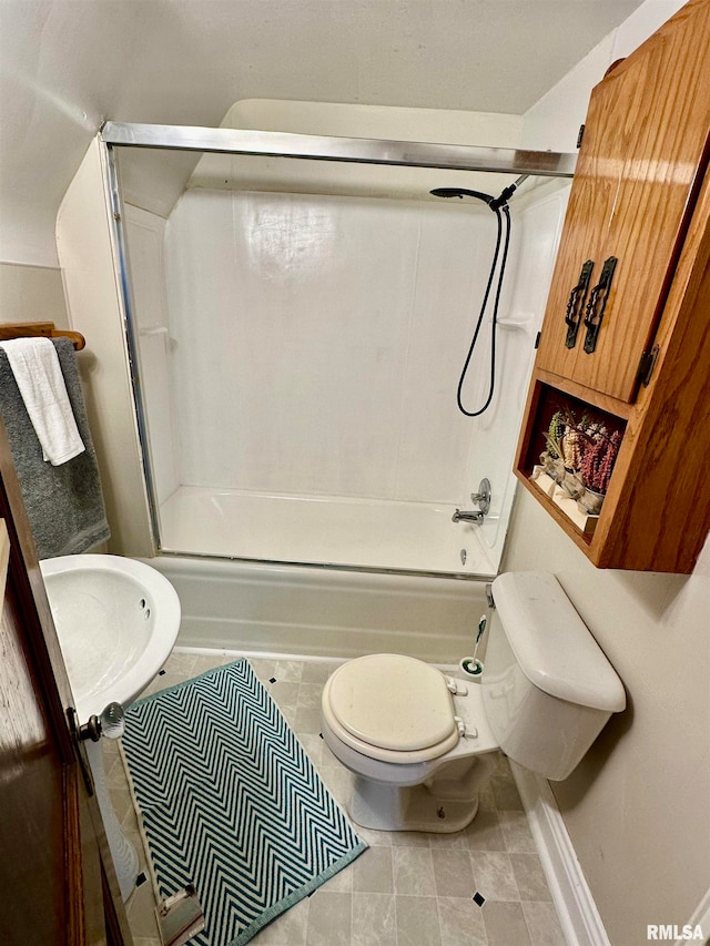 bathroom featuring bath / shower combo with glass door, tile patterned flooring, and toilet