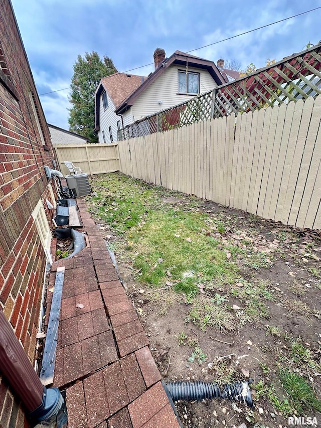 view of yard with central AC unit