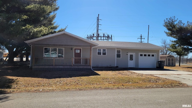 ranch-style house with a garage, a porch, and concrete driveway