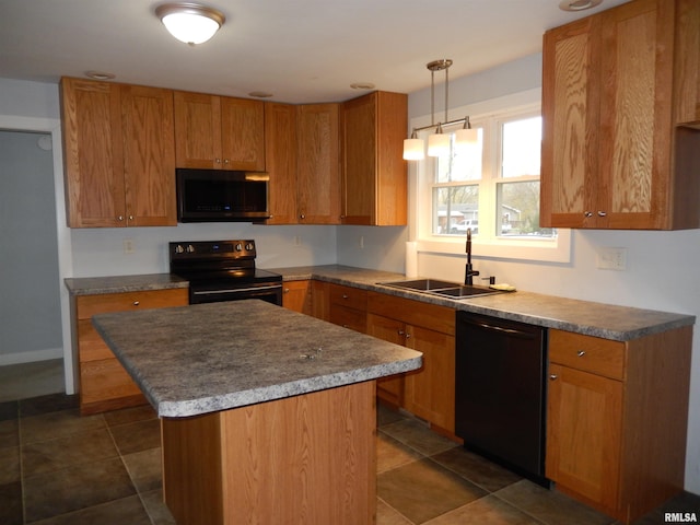 kitchen featuring a kitchen island, black appliances, sink, dark tile patterned flooring, and decorative light fixtures