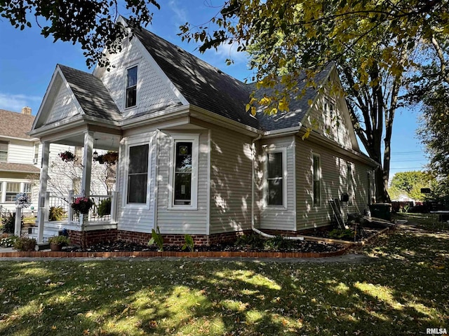 view of home's exterior with a lawn