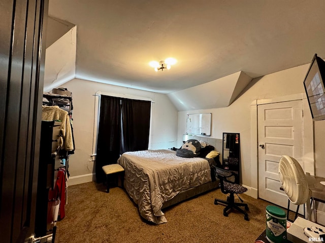 carpeted bedroom featuring lofted ceiling