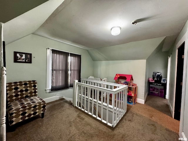 carpeted bedroom with vaulted ceiling