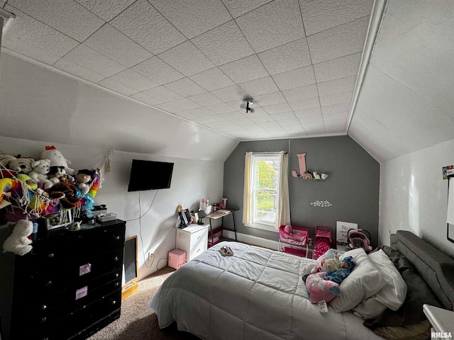 carpeted bedroom featuring vaulted ceiling