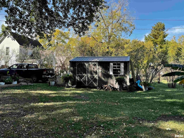 view of outbuilding featuring a lawn