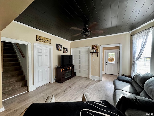 living room featuring crown molding, wood ceiling, and light hardwood / wood-style floors