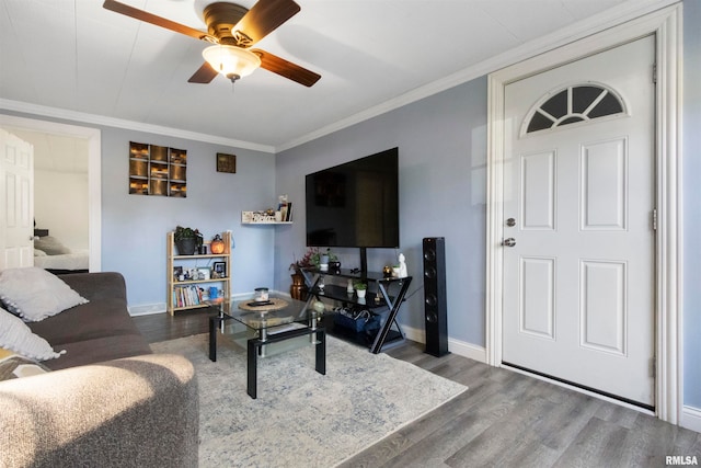 living room with crown molding, hardwood / wood-style flooring, and ceiling fan