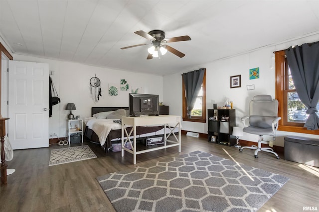 bedroom with dark hardwood / wood-style flooring