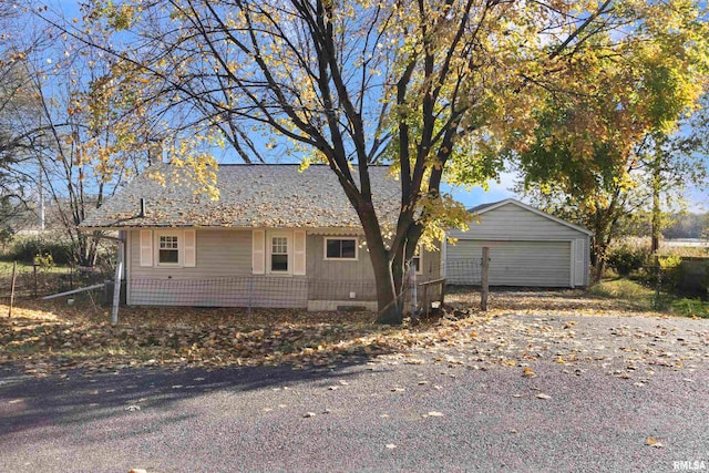 view of side of property with an outbuilding and a garage