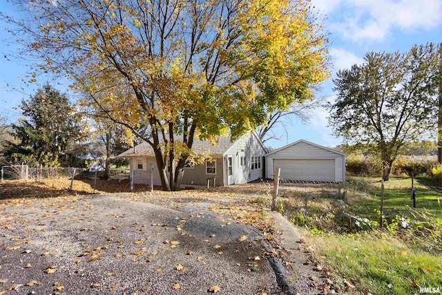 view of front of home featuring an outbuilding and a garage