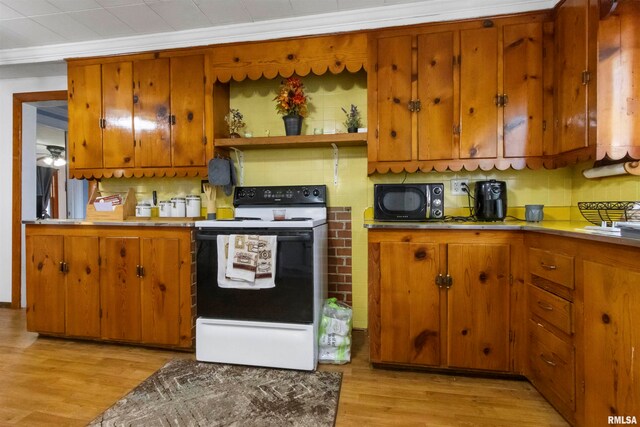 kitchen with electric stove, backsplash, ornamental molding, and light hardwood / wood-style floors