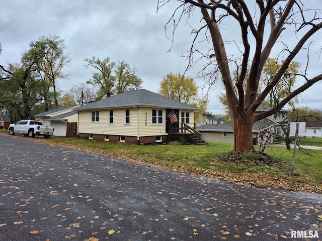 view of side of property with a garage