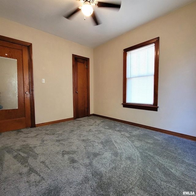 unfurnished bedroom with ceiling fan and carpet floors