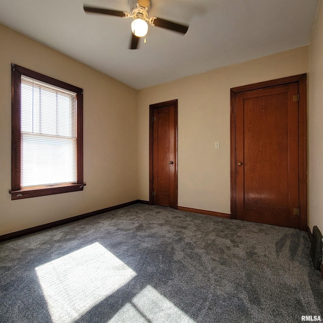 unfurnished bedroom featuring carpet and ceiling fan