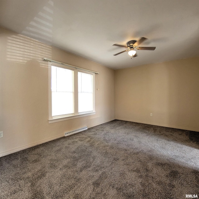 carpeted spare room with a baseboard radiator and ceiling fan